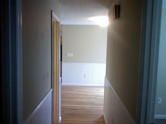 Hallway with hardwood