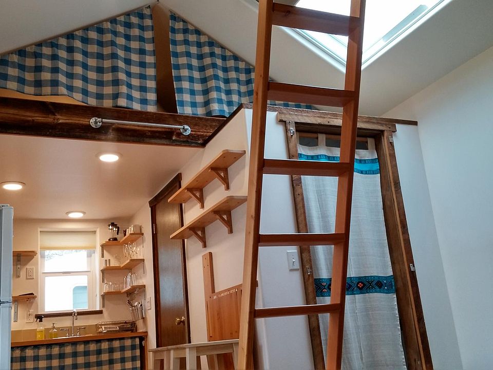 Closet, kitchenette, storage above leading to bathroom
