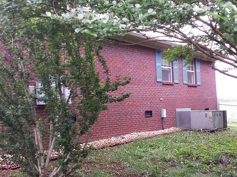 right side of house with new A/C unit