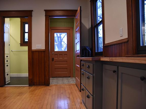 Kitchen with view to back entry and main level bathroom