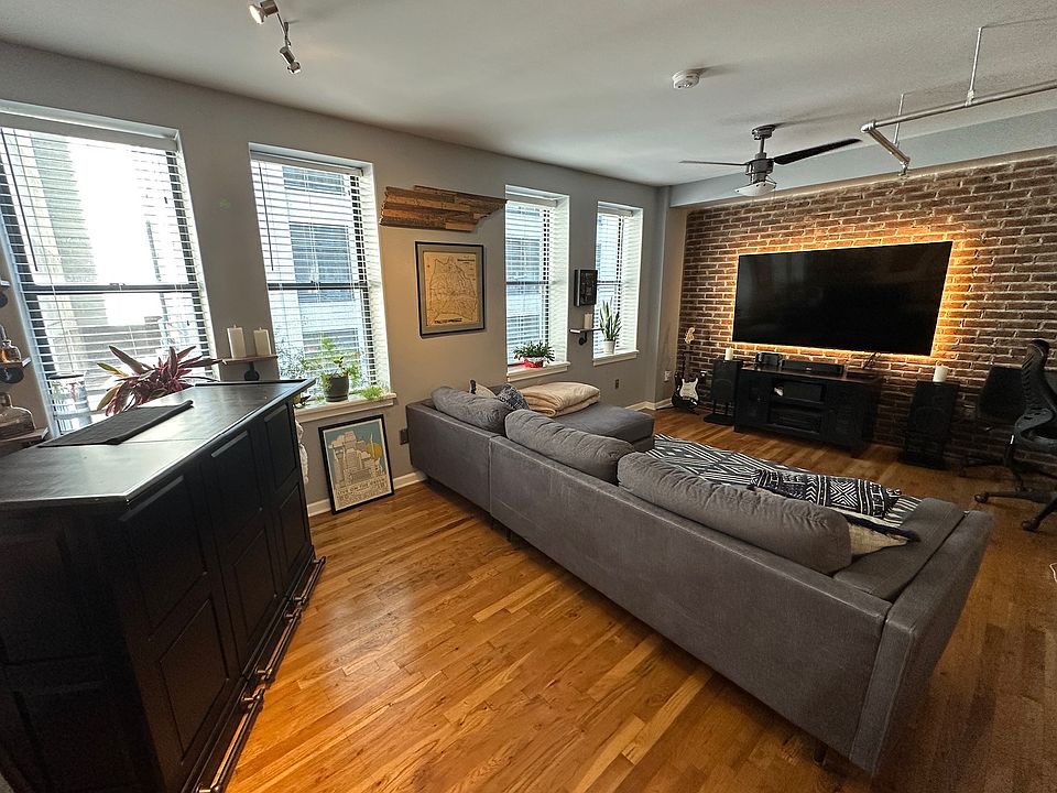 Living room with original exposed brick.