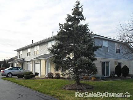 Side of House
						:
						Large concret slab on side of house, Sliding glass door replaced 2009