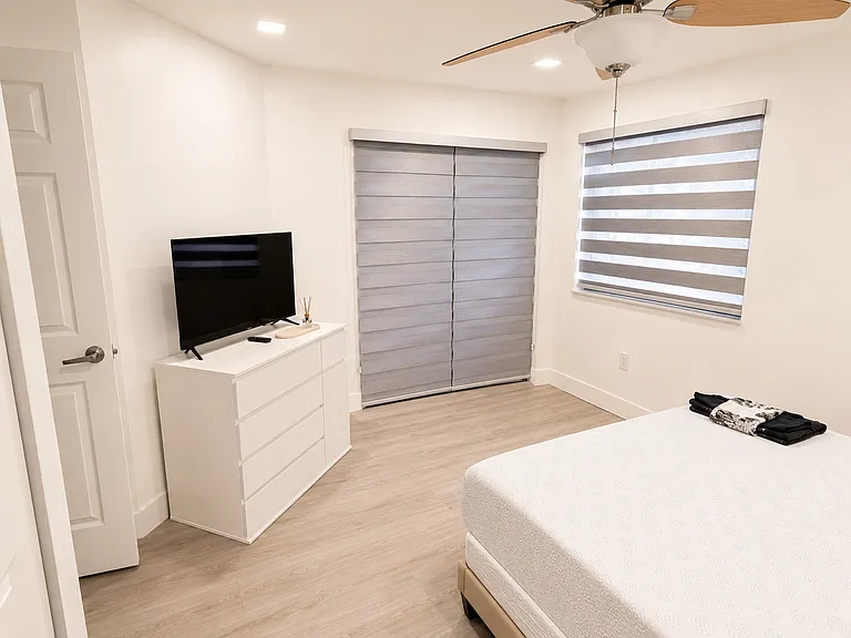 Guest Bedroom - Access to balcony via sliding door.
