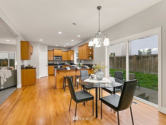 Spacious Chef's Kitchen with eating space connected to family room for seamless dining and relaxing. 