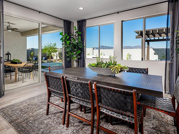 An image of the dining area in the Solstice model home at Mariposa in Blossom Rock.