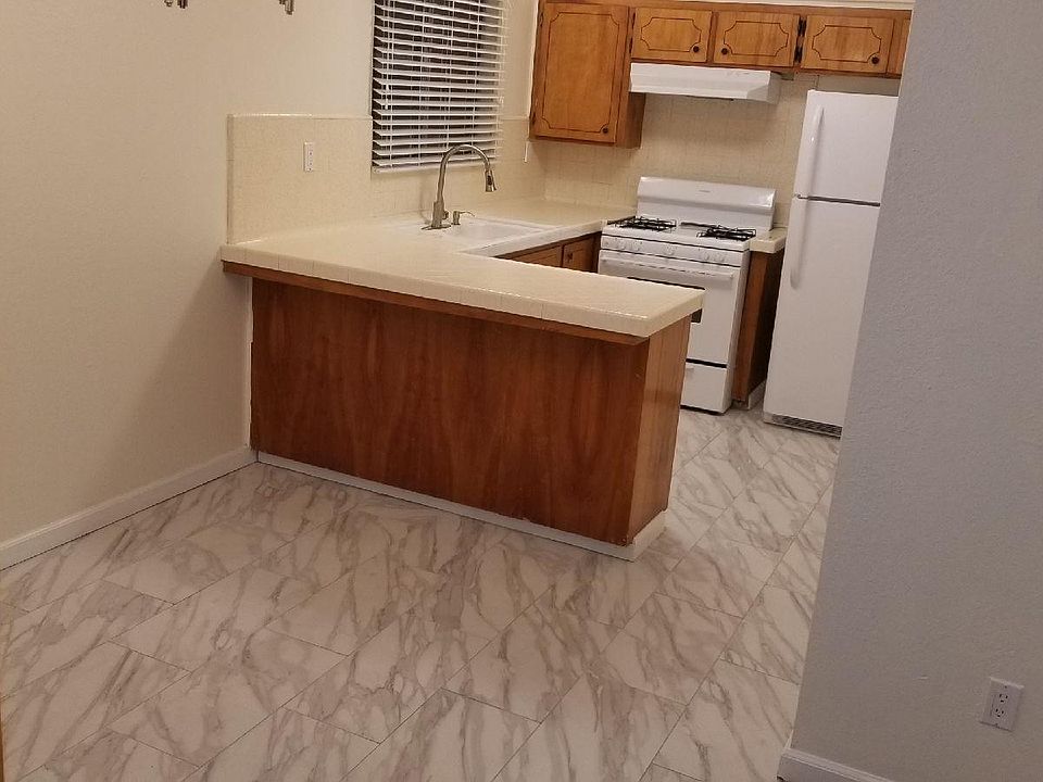Newly Remodeled kitchen with tile floor and new appliances