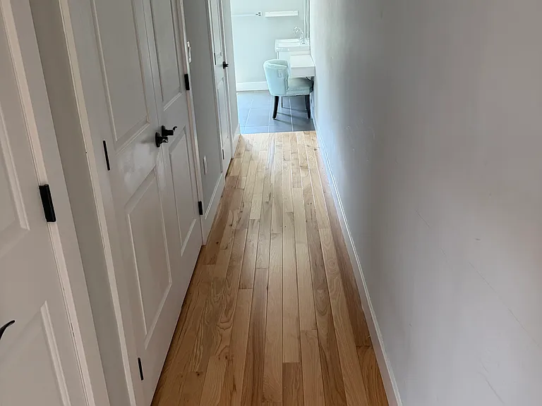 Master suite hallway with laundry