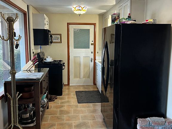 Garden Level- Kitchen with View of Water-Patio Runs Entire Front of Kitchen and Living Room