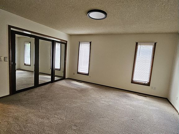master bedroom, large closet behind mirrored doors