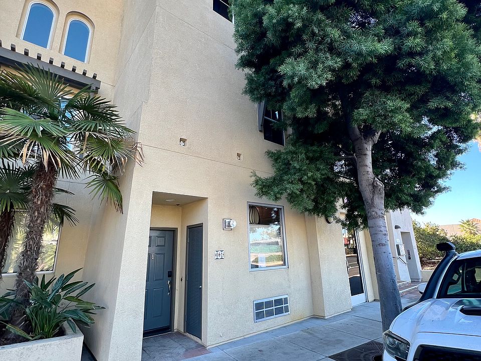 Entrance from sidewalk. The unit is above a ground floor satellite office owned by the unit owner.