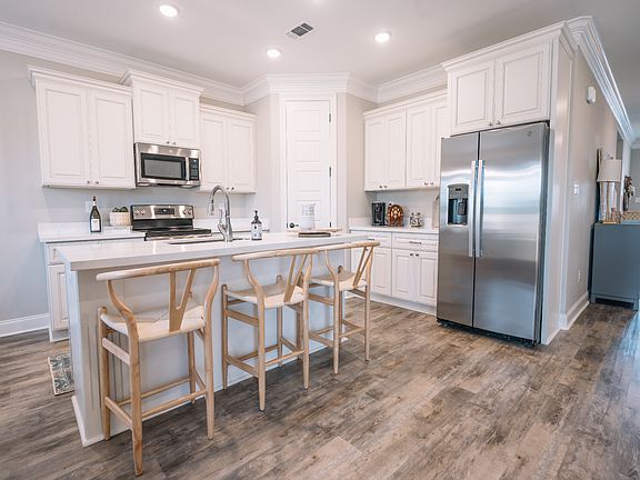 Kitchen in the Coral floorplan at a Meritage Homes community in Gulfport, MS.