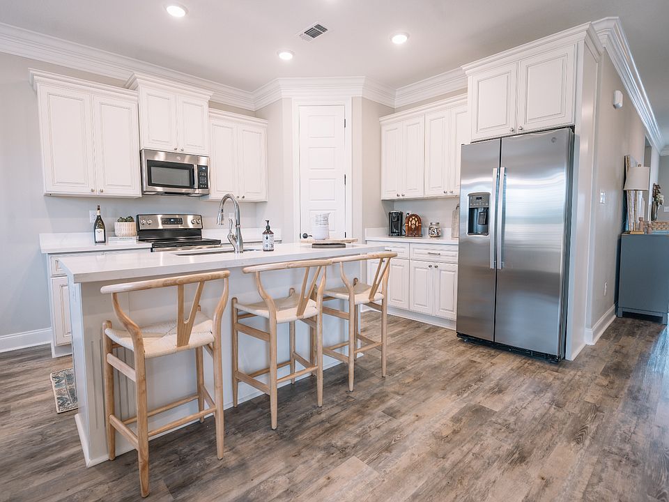 Kitchen in the Coral floorplan at a Meritage Homes community in Gulfport, MS.