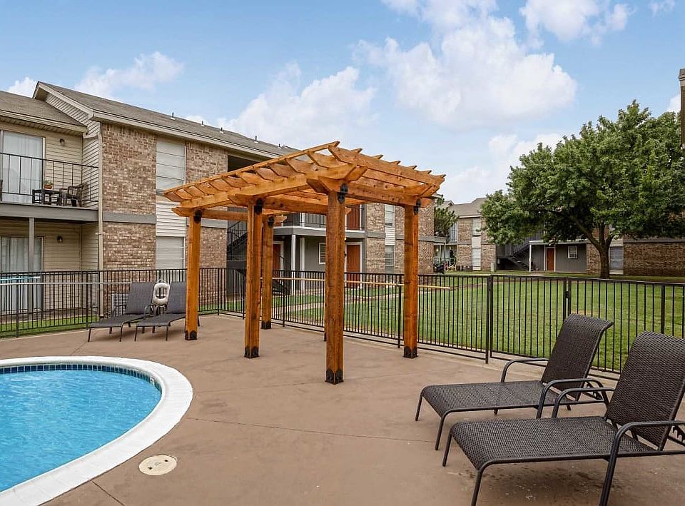 sparkling swimming pool with sun deck