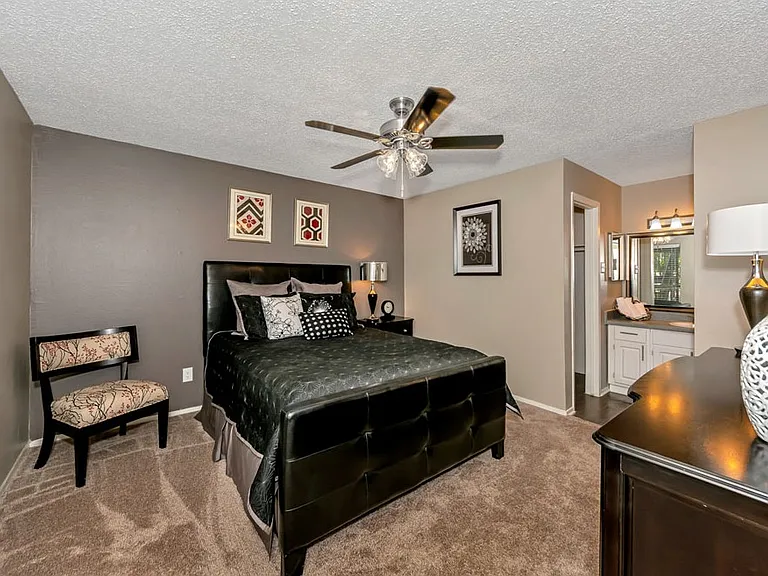 Primary bedroom with ceiling fan and comfortable layout