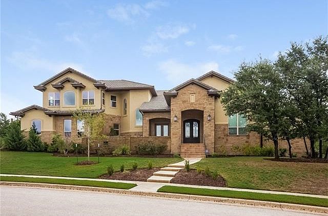 Welcome home to your contemporary custom-built stone and stucco 5-bedroom home in the Bluffs of Steiner Ranch
