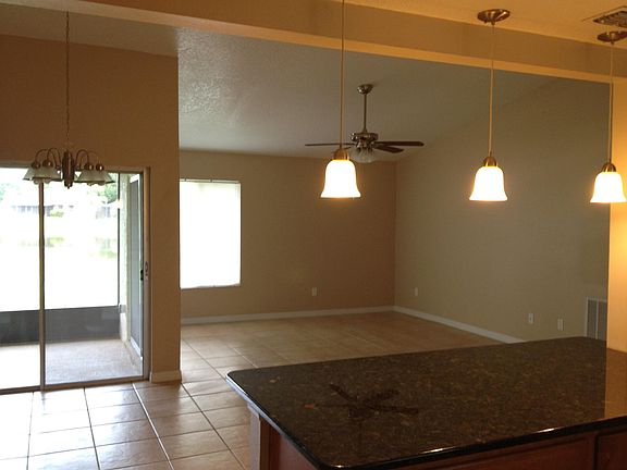 Pendent lighting. Ceramic tile throughout home