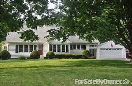 House From the Road
						:
						Nice distance from the road, parking for 3 cars to the right of the garage.