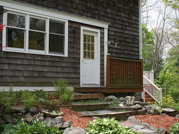 SIDE ENTRANCE, TO KITCHEN AND 1/2 BATH