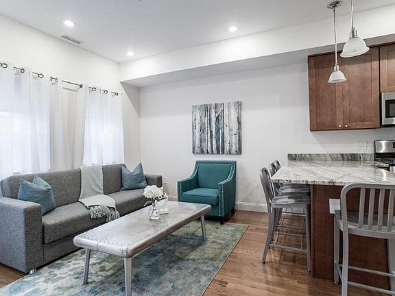 Open living room with fold out couch and smart HD TV