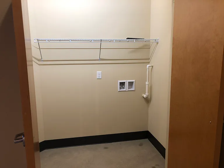 Apt 310 and 410 (2 BR) entrance closet with washer/dryer hookup