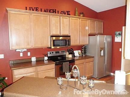 40" Maple Cabintes with under cabinet lighing and hardwood floors.