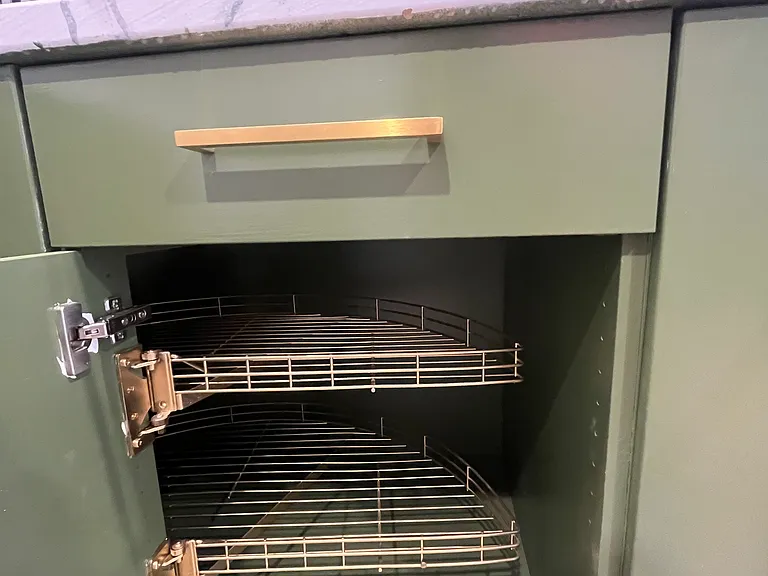 Base cabinet with spin out trays