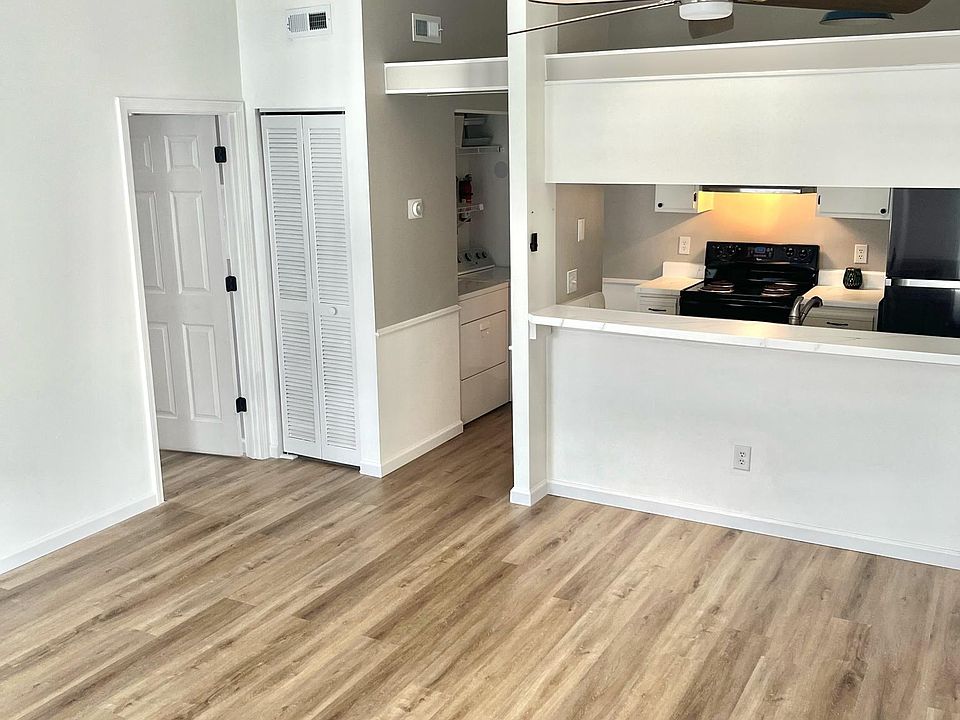 vaulted ceilings with skylight in kitchen and living room