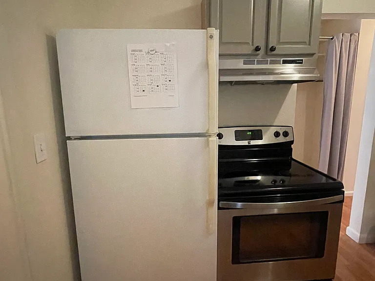 Kitchen with fridge and stove.
