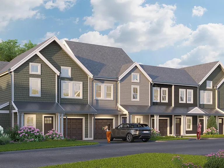 Townhome-style residences with attached garages, private entries, and classic New England_inspired exteriors.