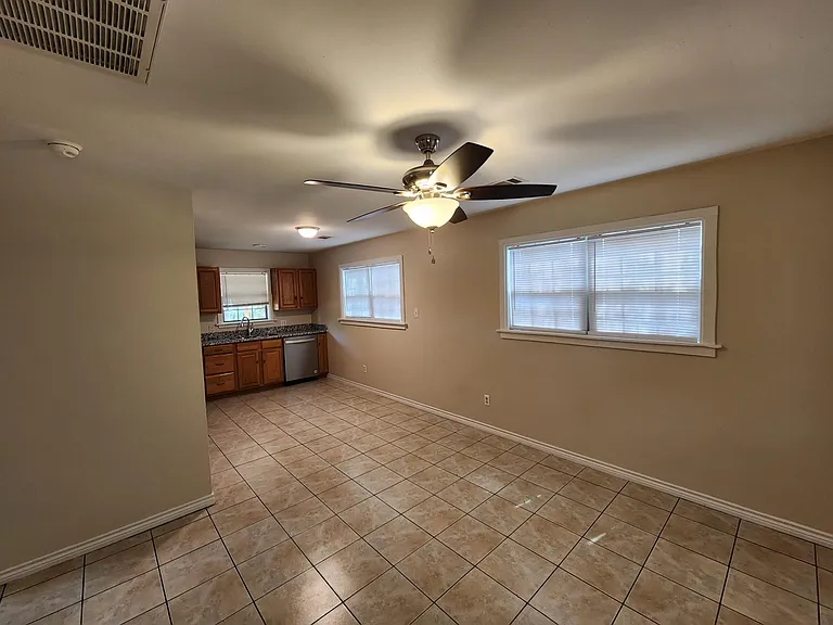 Living room toward dining area and kitchen
