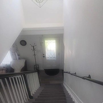 Staircase to bedroom with safety handrails