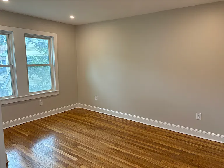 Bedroom #2 - New windows, refinished hardwood floors, new electrical, new doors, new sheetrock, and new insulation.