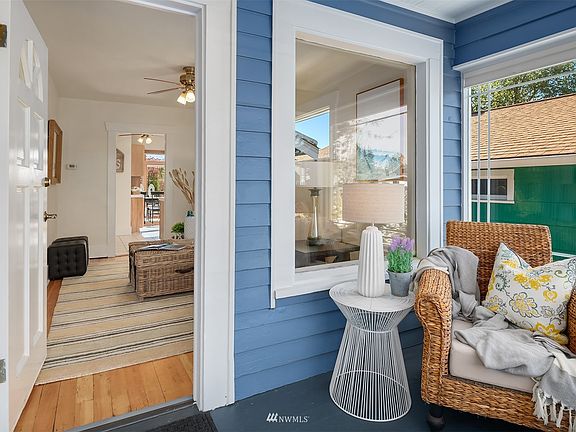 Sit back and relax with a good book, cup of coffee, or glass of wine in this cozy sunroom.