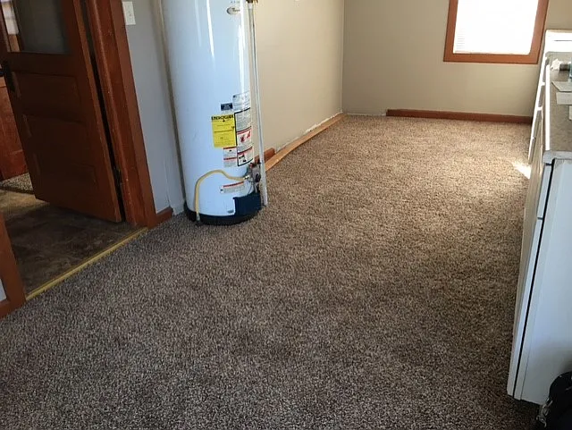 Laundry room area with water heater