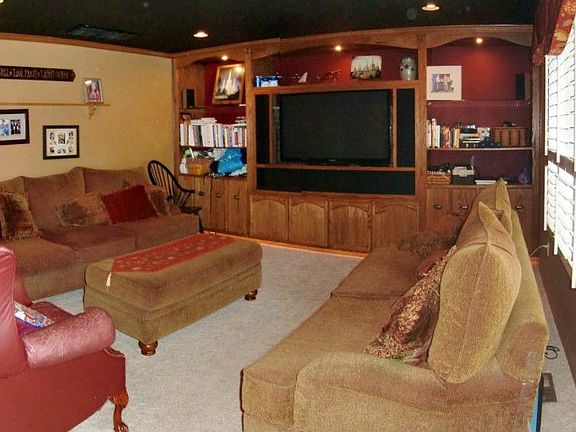 Fireplace behind TV now in use and gross ceiling is no longer black