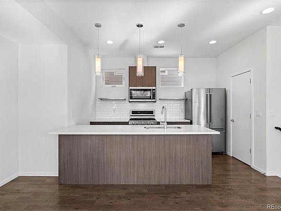 Kitchen with door to primary floor bathroom
