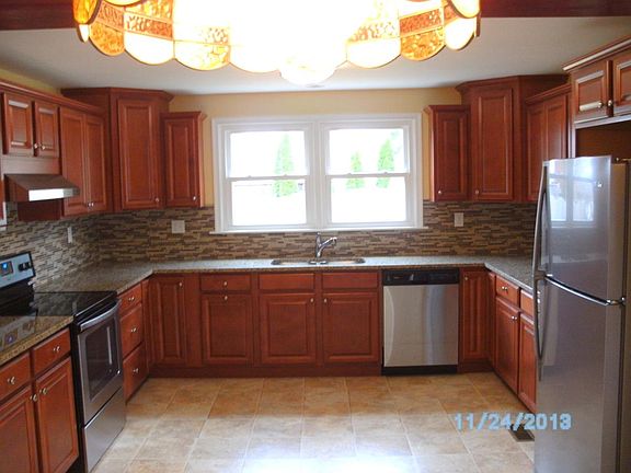 Large kitchen with granite countertops and stainless applian