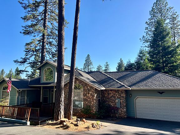 Front of home. A long driveway leads from the street to the home providing privacy.