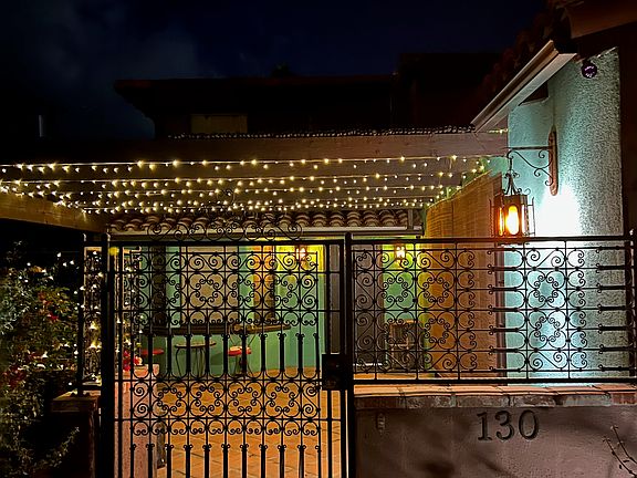 gated courtyard is welcoming at night