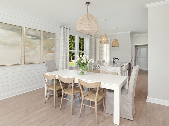 Dining Area with a lovely Shiplap wall. Model Representation.