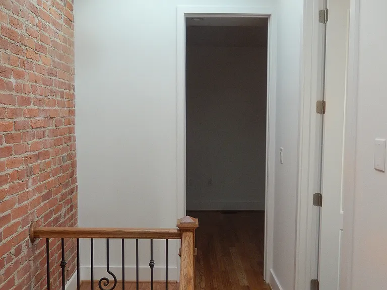Entrance to third floor rear bedroom.