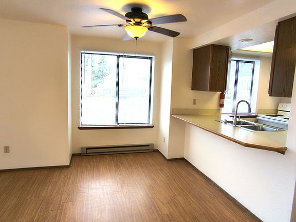 Dining area with ceiling fan.