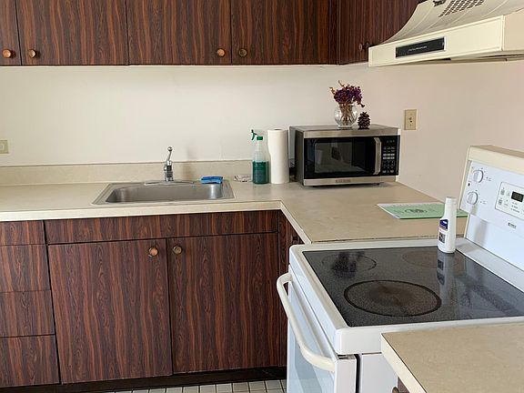 Clean kitchen with lots of cabinet space.