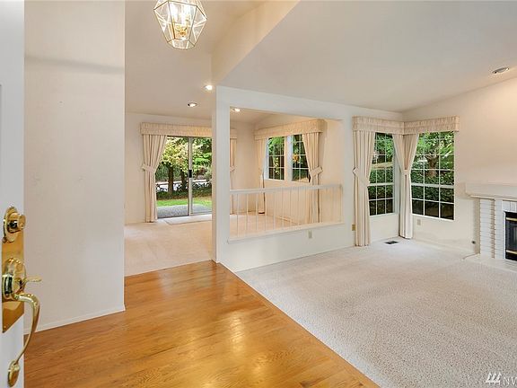 The entry leads to a formal living room with vaulted ceilings, dining room and first of 2 patios to backyard...