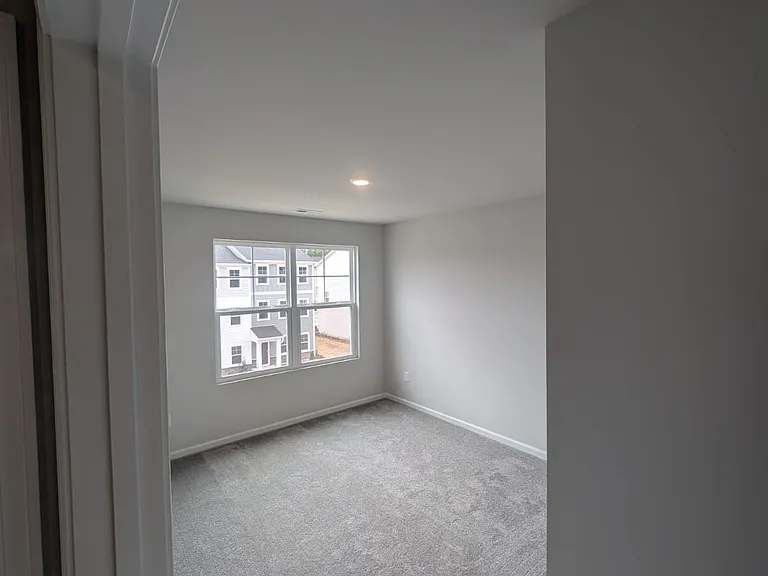 View of one of the other bedrooms on the third floor