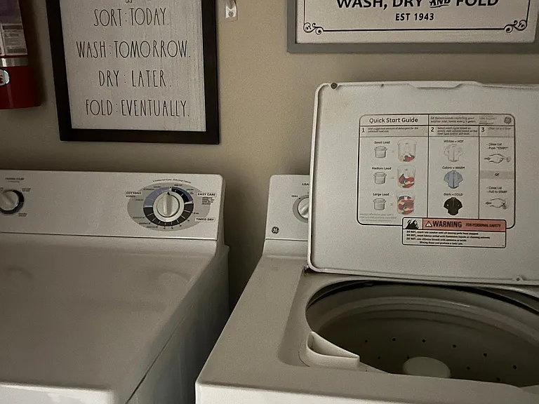 Laundry area with washer and dryer inside the apartment