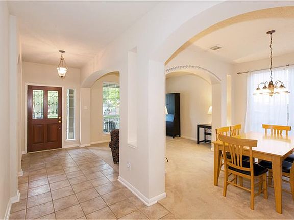 The living room and formal dining room are separated by an archway.  The dining room is large enough to host your next gathering.
