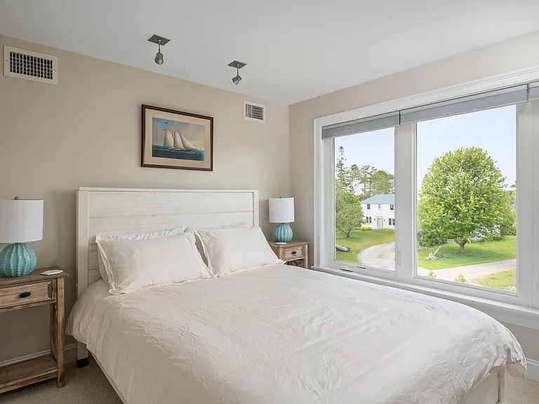 the third floor bedroom with a queen size bed