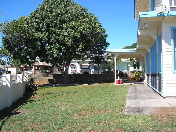 Large yard with a gated entrance.
