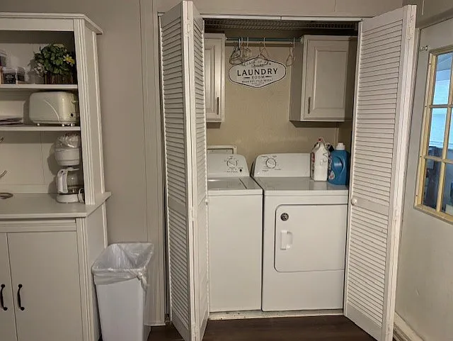 Designated Washer and dryer closet accessed in kitchen. Also: Microwave or coffee cabinet with shelves for add'l storage.